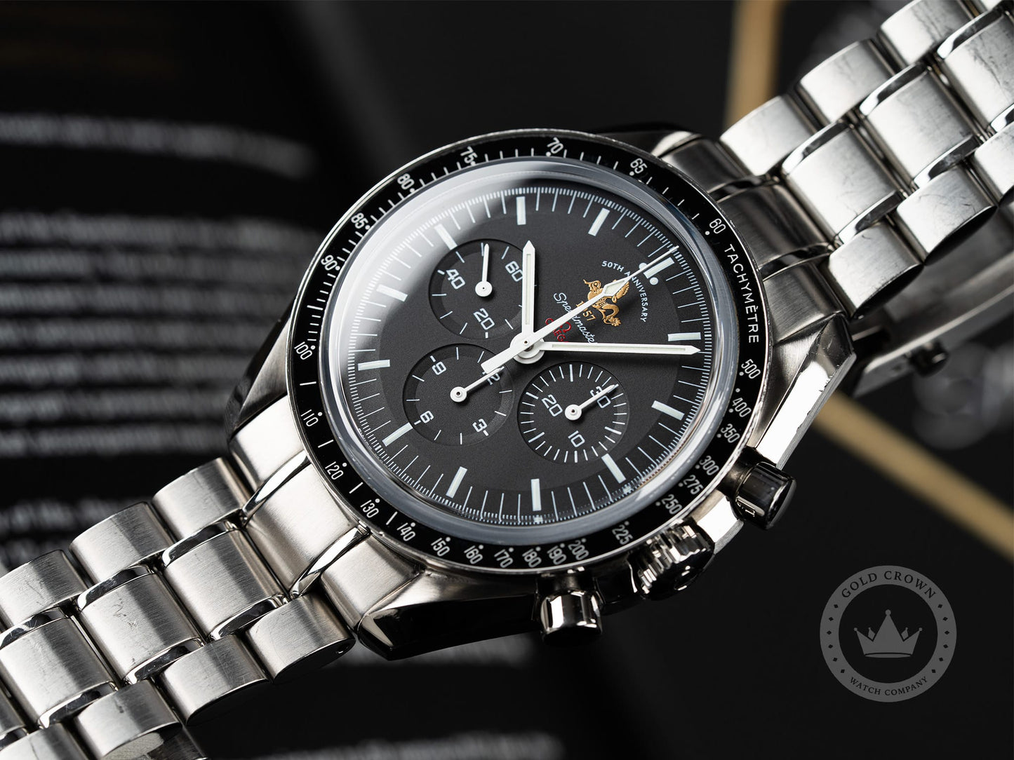Omega Speedmaster 311.30.42.30.01.001 “50th Anniversary” Watch and Paper